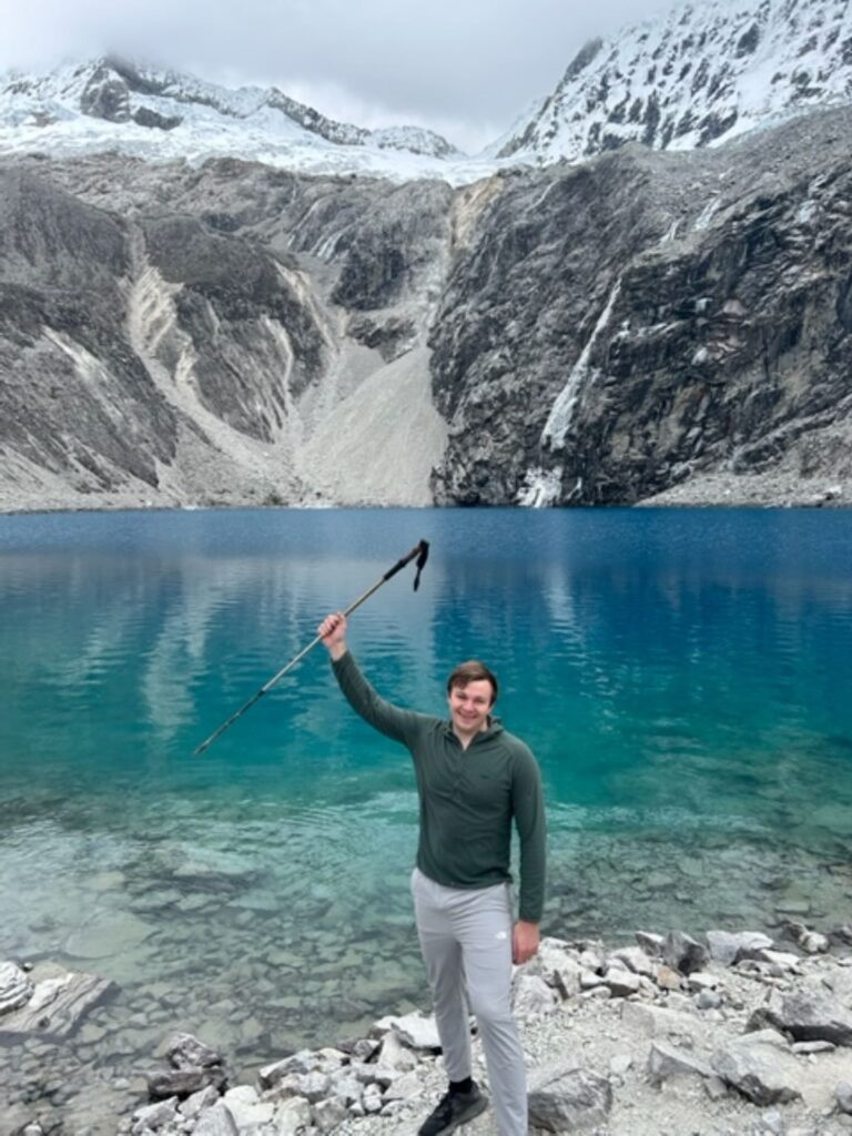 Sam Arnold '23 arrives at a glacial lake more than 15,000 feet above sea level after a nine 9-mile hike near Huarez, Peru. 