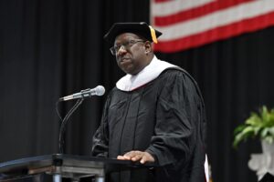 Gladstone “Fluney” Hutchinson, associate professor of economics and policy studies, delivered the commencement address at SUNY Oneonta on May 18. Photo courtesy of SUNY Oneonta and Gerry Raymonda.