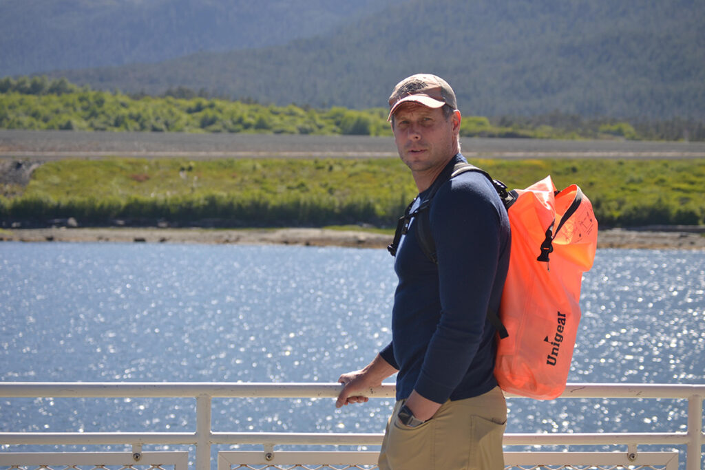 David Sunderlin smiles in front of a body of water.