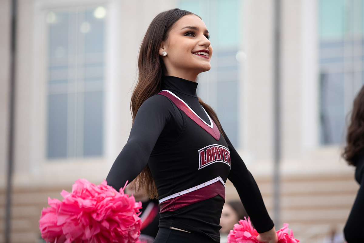 Anna Van Ormer ’25 is featured in her dance uniform at Fisher Field.