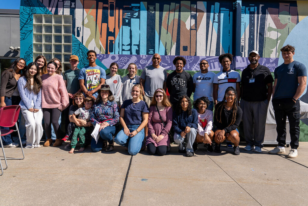 Students pose together in a photo outside of the Boys and Girls Club.