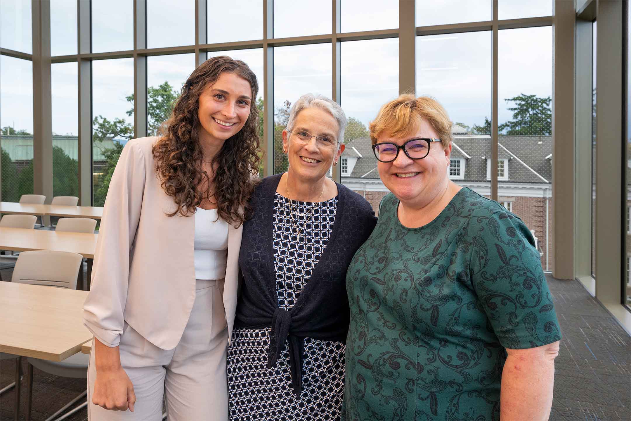 Katrina Ruggiero '20, Rosie Bukics, retired professor of Economics, and Heidi Hanson smile at the camera