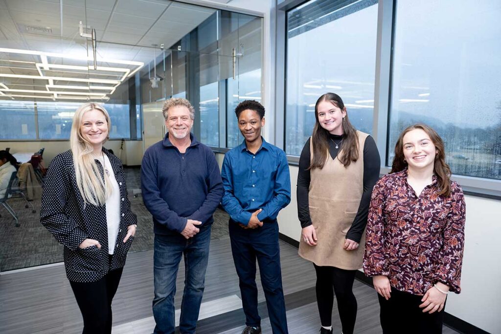 Prof. Sarah Appelhans, Prof. Jim Toia, Don Bosco Haingura ’25, Eva Drotch ’25, and Emily Mastroly '25 at the EGRS 451 capstone presentation