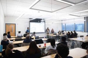 Don Bosco Haingura ’25, Eva Drotch ’25, and Emily Mastroly '25 presenting their KSAT Spoken Word Project at the EGRS 451 capstone presentation