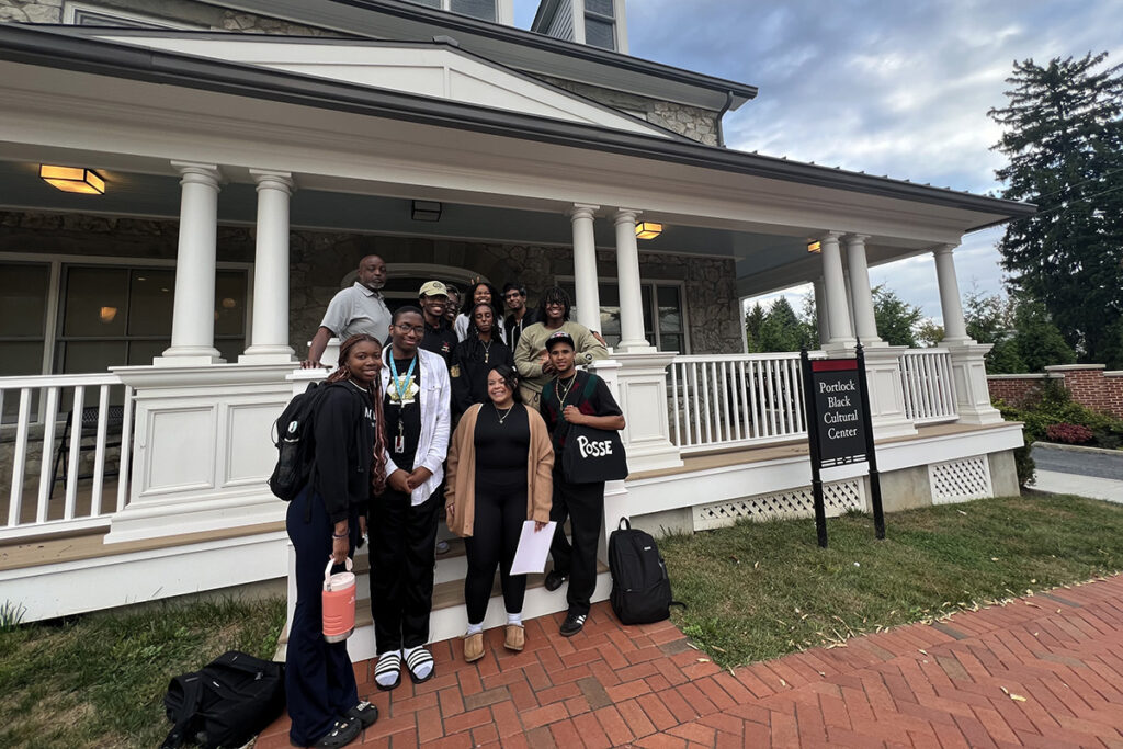 Students and Ernest Jeffries stand outside of Portlock Black Cultural Center