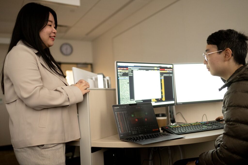 Prof. Yang Jie, assistant professor of economics, and Eric Wang ’26 | Photo by Adam Atkinson