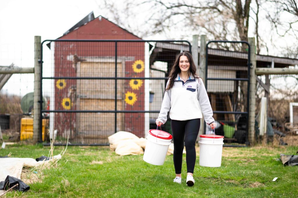 Jacqueline Britton ’25 smiles at LaFarm