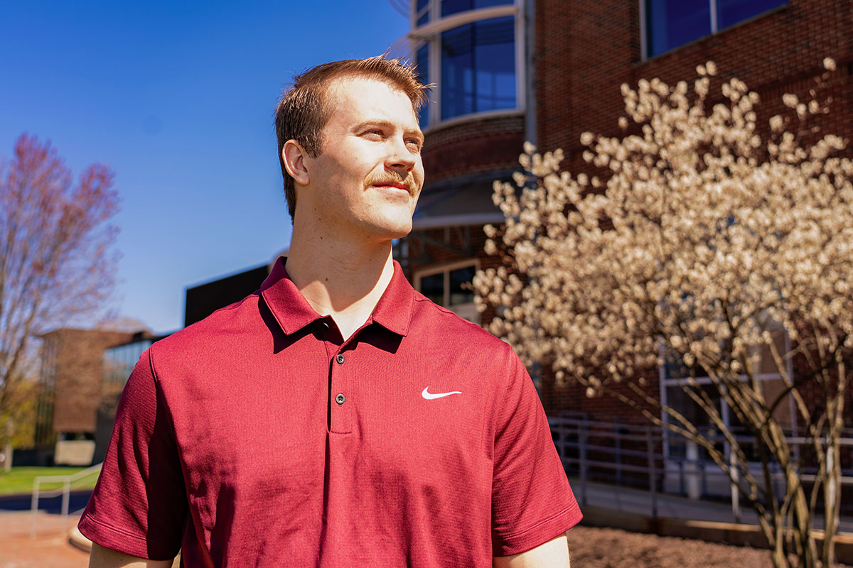 Tyler Roberts '25 stands in front of Hugel Science Center