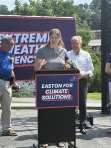 Prof. Christa Kelleher speaks at extreme weather press conference. 