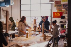 Prof. Nestor Gil working with students in Sculpture I course