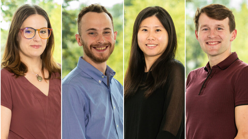 Four faculty members smile