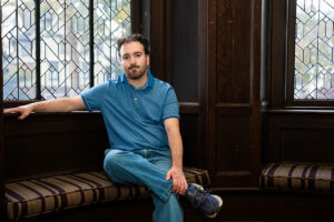 Christopher Byrnes ’26 sits in the McKelvy house