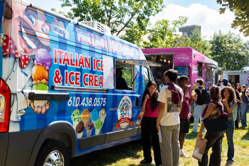 Students stand near the Uncle Louie G's food truck on the Quad during the Marquis de Lafayette birthday celebration.