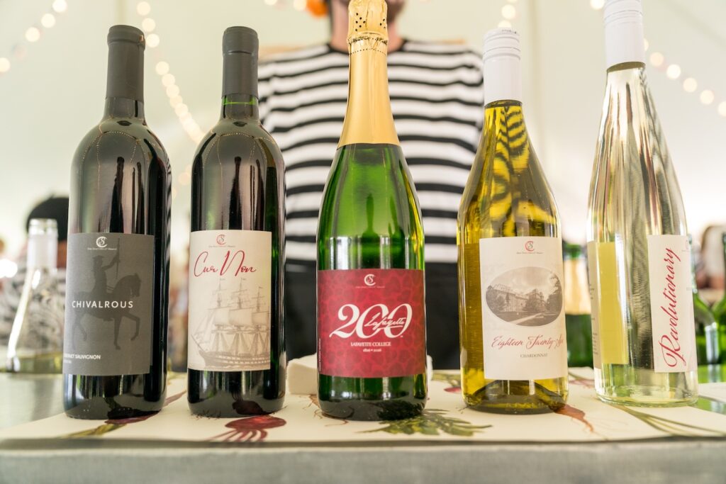 Five bottles of wine with commemorative Lafayette labels are pictured.