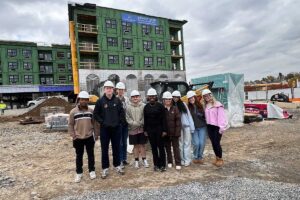 Students in Mary Wilford-Hunt's Introduction to Structural Engineering course posing in front of The Confluence during a site walk