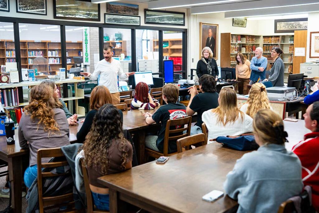 Prof. Matthew DeMaio delivering a lecture to students in his Anthropology of the City course inside the Easton Area Public Library