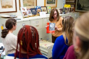 Experts at the Easton Area Public Library showing Anthropology of the City students the various printed archival resources that are available to them there