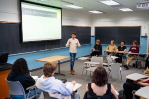 Prof. Mathieu Smith-Perrot lecturing to students in the classroom during his First-Year Seminar The Boring Class