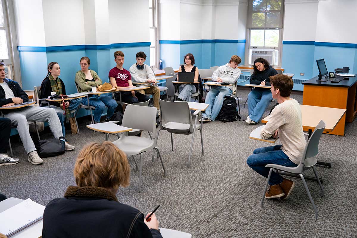 Prof. Mathieu Smith-Perrot lecturing to students in the classroom during his First-Year Seminar The Boring Class