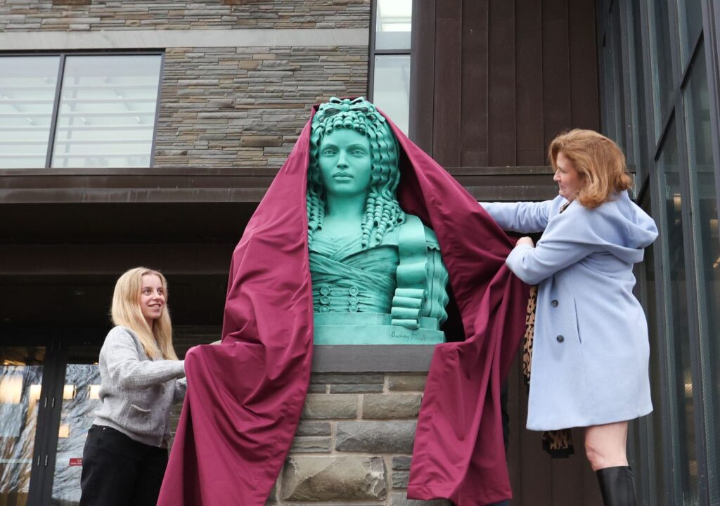 Allie Waxman ’28, president of student government, joins President Nicole Hurd in unveiling Adrienne at Skillman Library on March 7. Photo by Ashli Truchon Novak