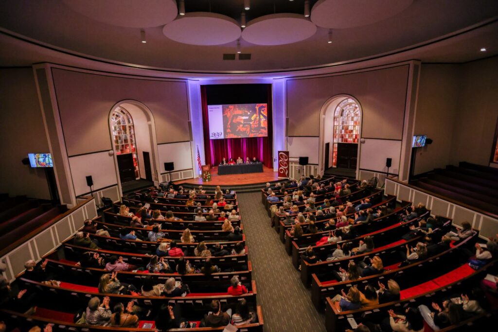 Before the unveiling, guests filled Colton Chapel for a panel discussion, “The Making of Adrienne.” | Photo by Ashli Truchon Novak