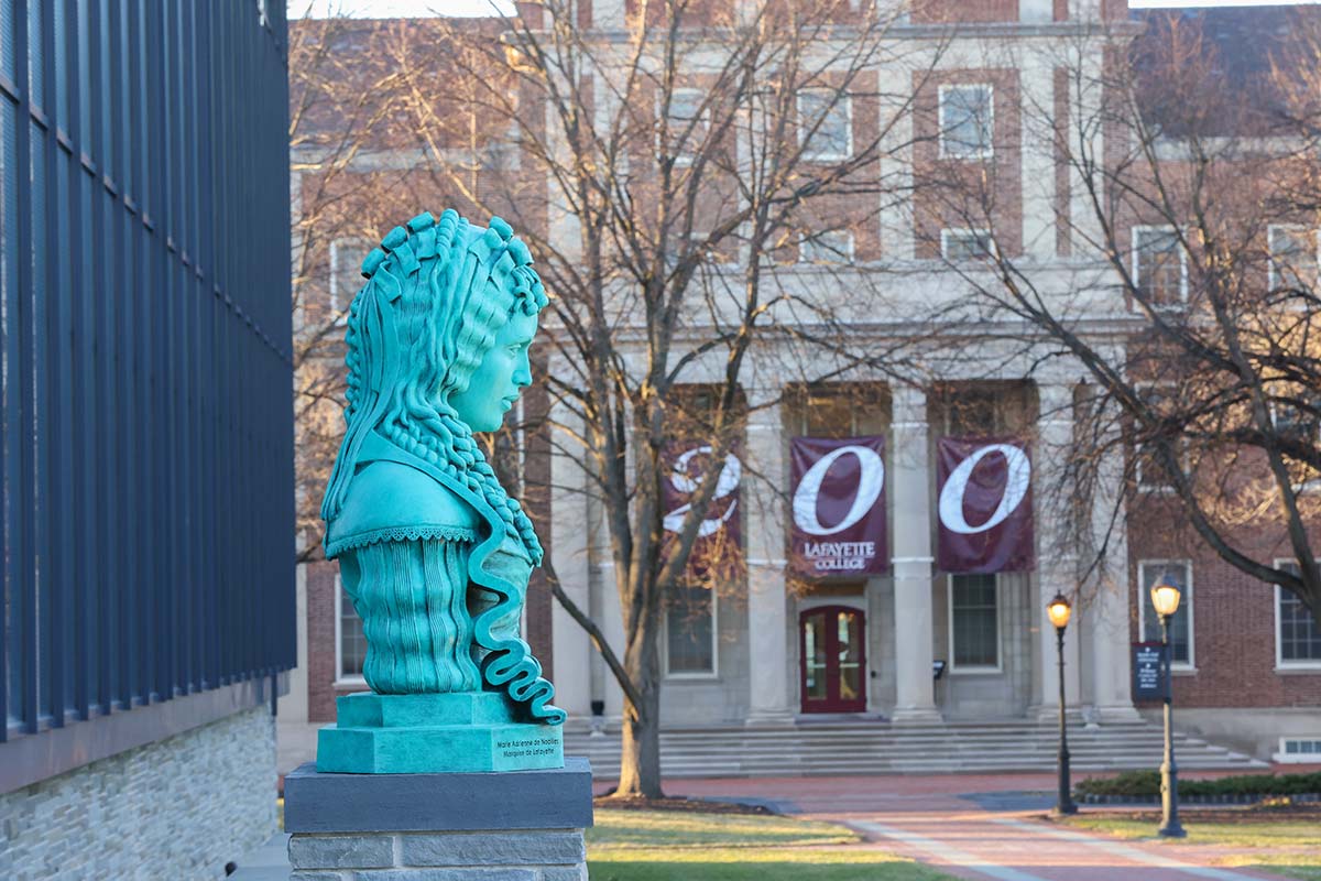 Statue of Adrienne in front of banners saying 200