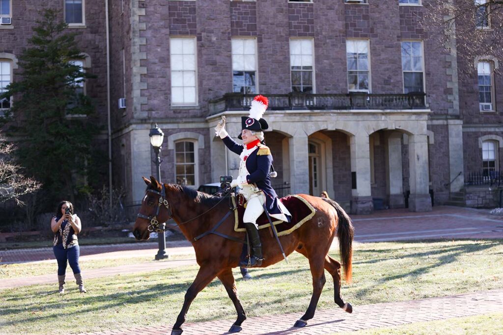 Marquis impersonator on a brown horse