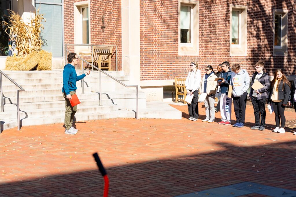 Prof. Mike McGuire stands with students in front of Acopian