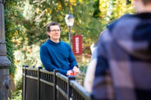 Mike McGuire leans against a railing