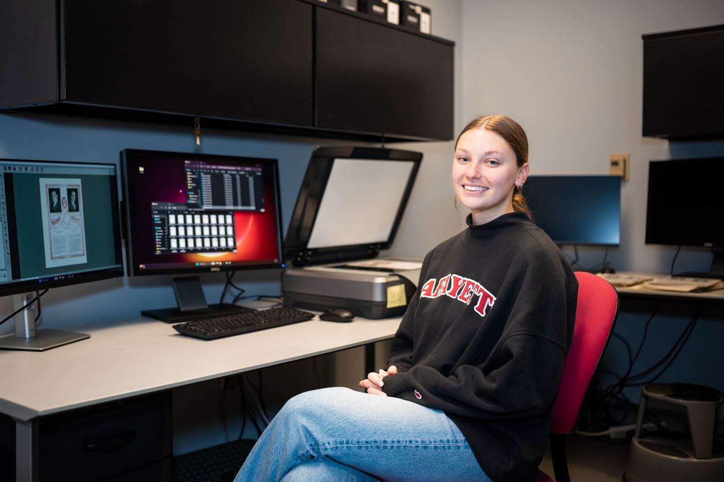 By happenstance, Katie Felsmann ’26, who has been assisting with the project, encountered her mom's yearbook and called her immediately. (Photo | JaQuan Alston)