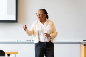 Prof. Wendy Wilson-Fall delivering a lecture to students during her AFS 330 Cowboys in Africa course