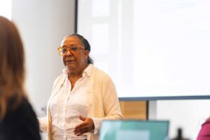 Prof. Wendy Wilson-Fall delivering a lecture to students during her AFS 330 Cowboys in Africa course