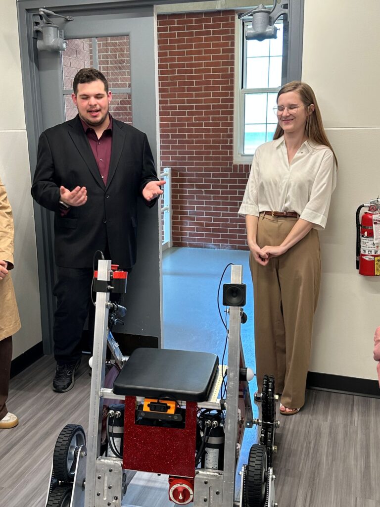 Daly Gibson ’26 and Sam Satalof ’26 describe the smart walking assistive before watchful students and faculty | Contributed photo 