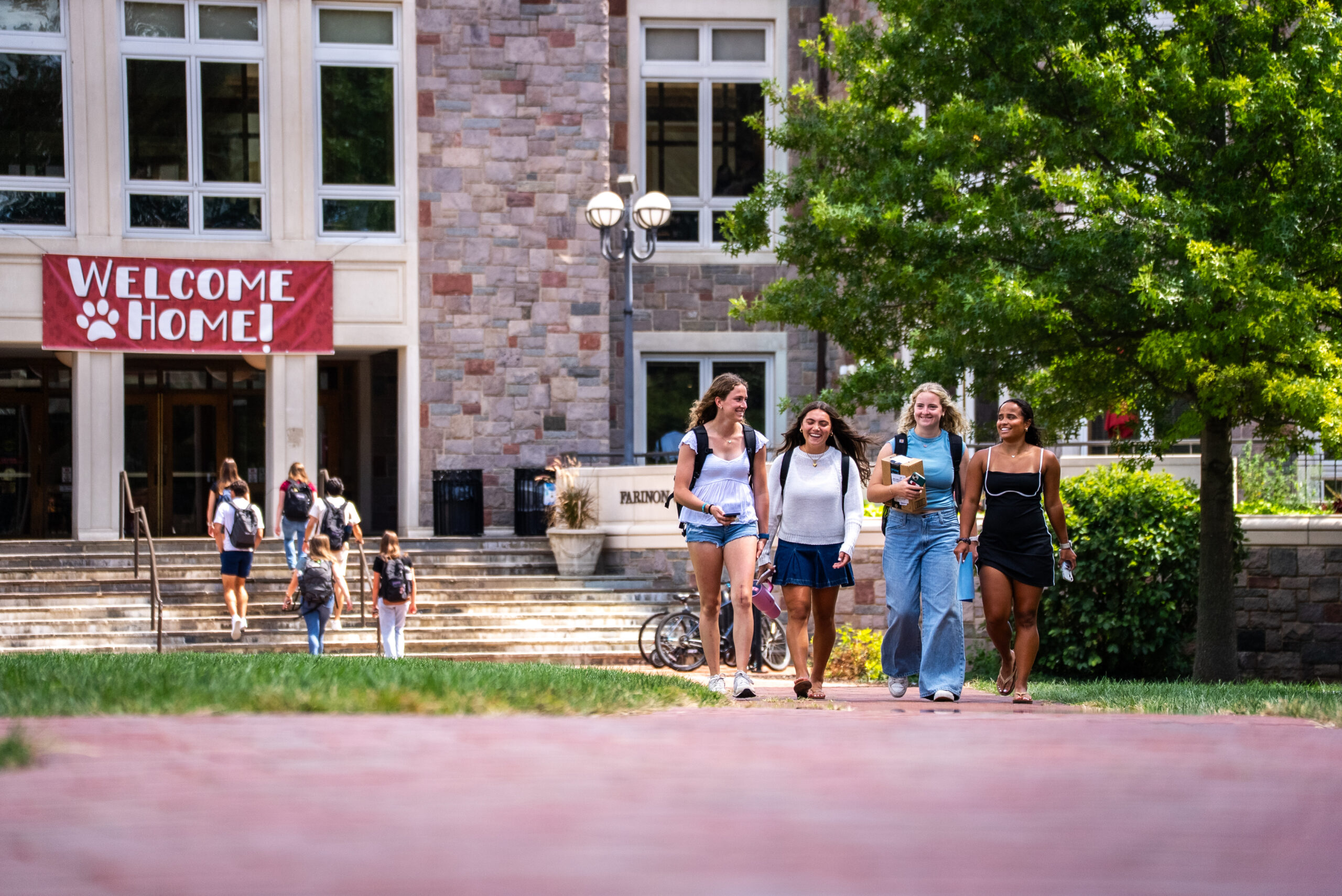 Students walk across camps