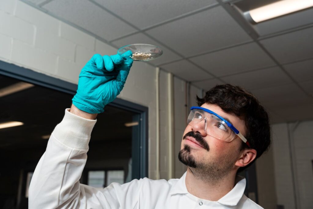 John Oramas ’27 inspects a high-quality betulin extract. (Photo | JaQuan Alston)