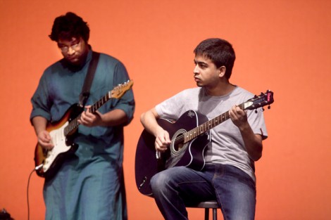 Two student guitarists perform on stage during the Extravaganza Grand Finale.
