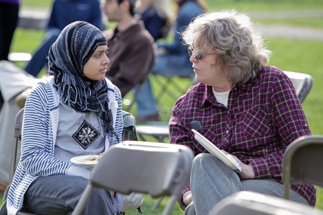 Thafhim Siddiqua '13 speaks with math professor Liz McMahon.