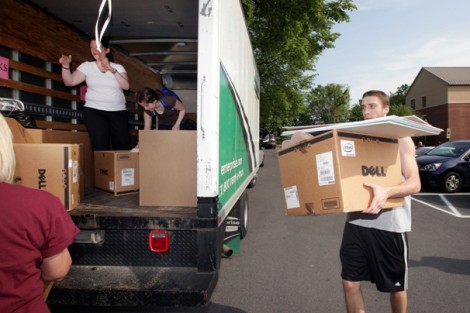 Ryan McNeill '12 helps load up the truck.