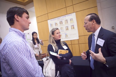 Ryan Stanley '11 (left) and Jill Nentwig '11 talk with Rob Goldstein '80 during the reception.