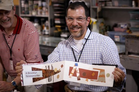 The artist and his creation made during the printmaking workshop.