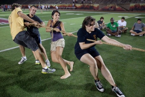 From left to right, Billy Stathis, John Pellecchia, Bonnie Malhotra, and Samantha Myerson, all Class 2015, compete in tug-of-war.