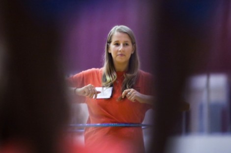 Stephanie Solomont '13 helps out during the hula hoop competition in Kamine Gymnasium.