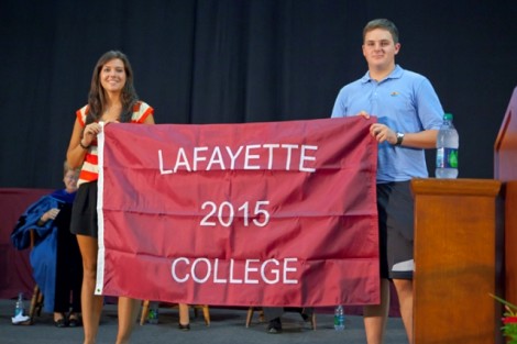 Kendall Glascott '15 and John Siegel '15 hold the Class of 2015 flag.