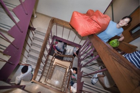 Students, family, and friends climb the steps in Ruef Hall.