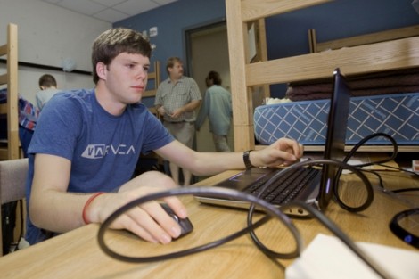 Stephen Hodge '15 fires up his computer in Kamine Hall.