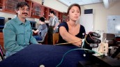 Luis Schettino, assistant professor of psychology, and Camille Borland '13 are researching a computerized, wearable glove that studies human grasping behavior.