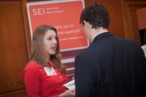 Janine Tkach '96 of SEI  consulting firm talks with Frank Dalicandro '12, an economics major.