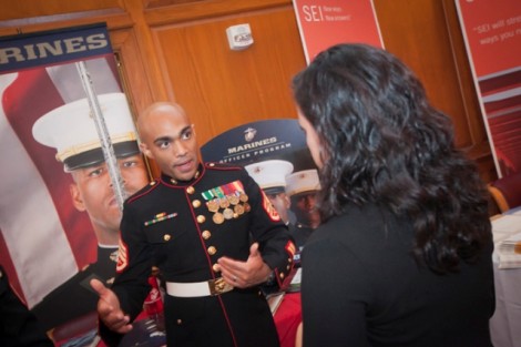 Marine Staff Sgt. Corey  Filson talks with a student. 