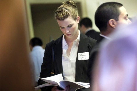 Madeleine Hasbrouck '14, an economics major, goes over the list of employers.