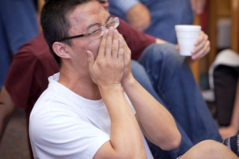 Sicheng Wang '14 laughs as he watches five non-Asian students try to sing a song in Chinese.